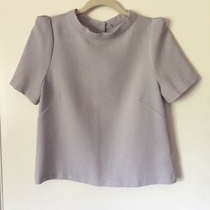 Puff sleeve blouse with button down closure in the back